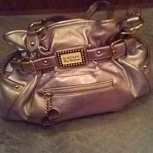 Kathy Van Zeeland handbag with charms.
